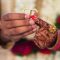 pexels photo 1456613 1456613 Close-up of hands with henna and jewelry during a traditional Indian wedding ceremony, exchanging rings.